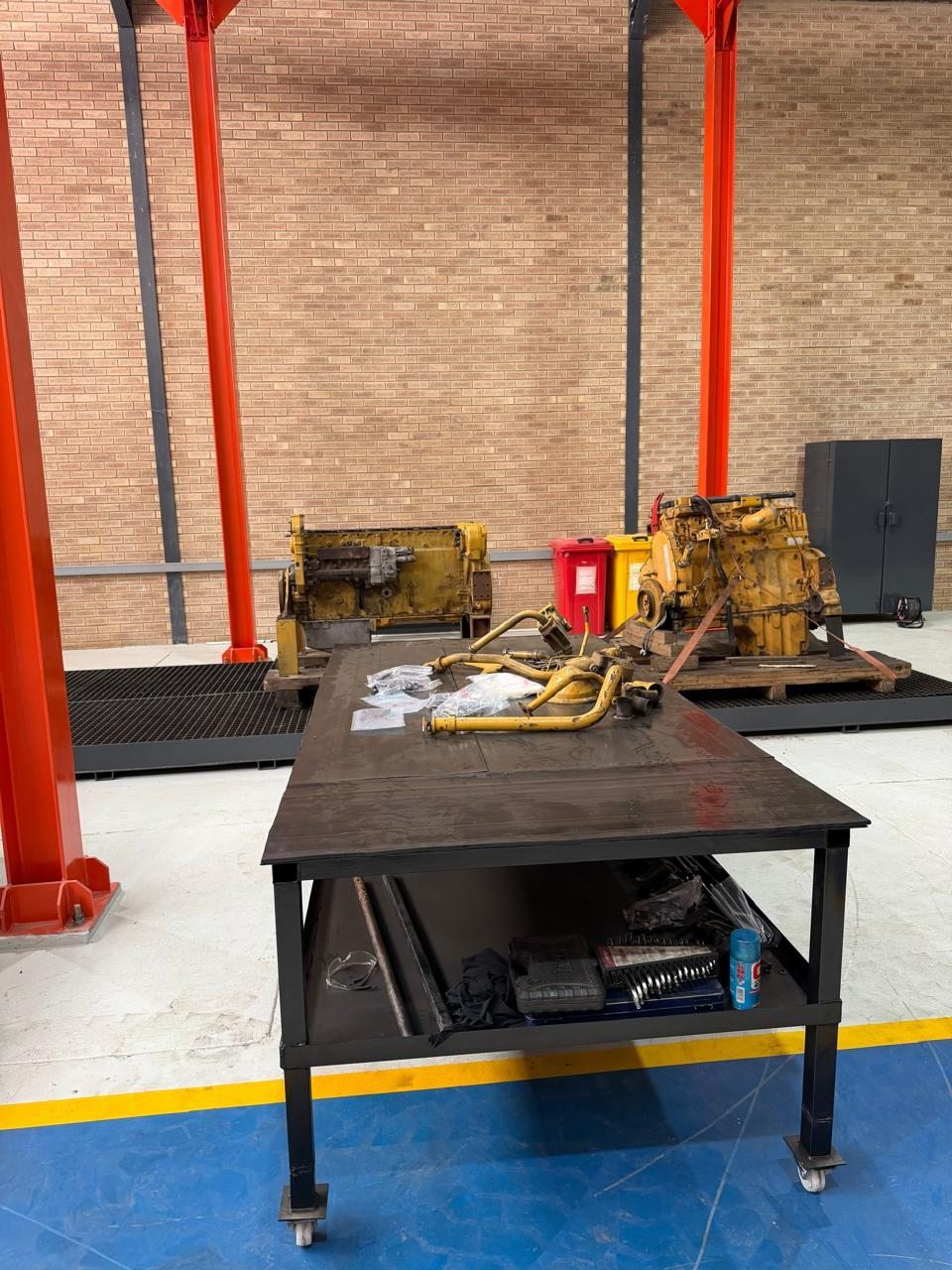 Stripped plant components laid out on a workshop bench